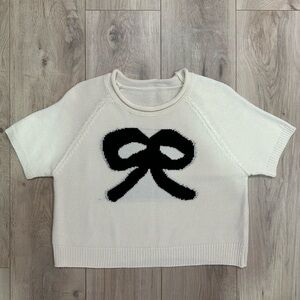 White Knit Sweater with Black Bow Design
